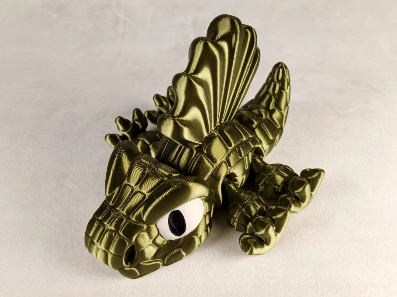 Dimetrodon Flexi Dinosaur, Dinosauro articolato verde seta stampa 3D a colori PLA lunghezza 14 cm.