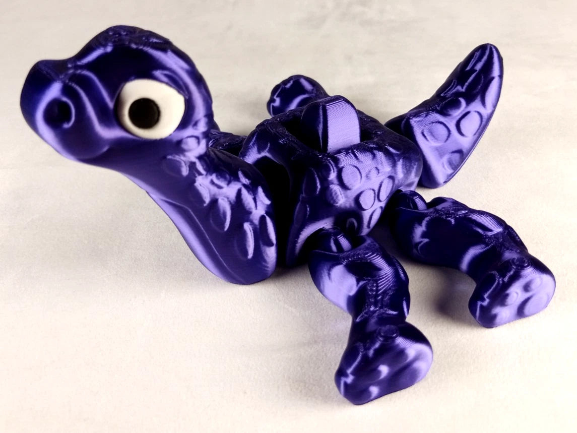 Apatosaurus Flexi Dinosaur, Dinosauro articolato Porpora seta stampa 3D a colori PLA lunghezza 17 cm.