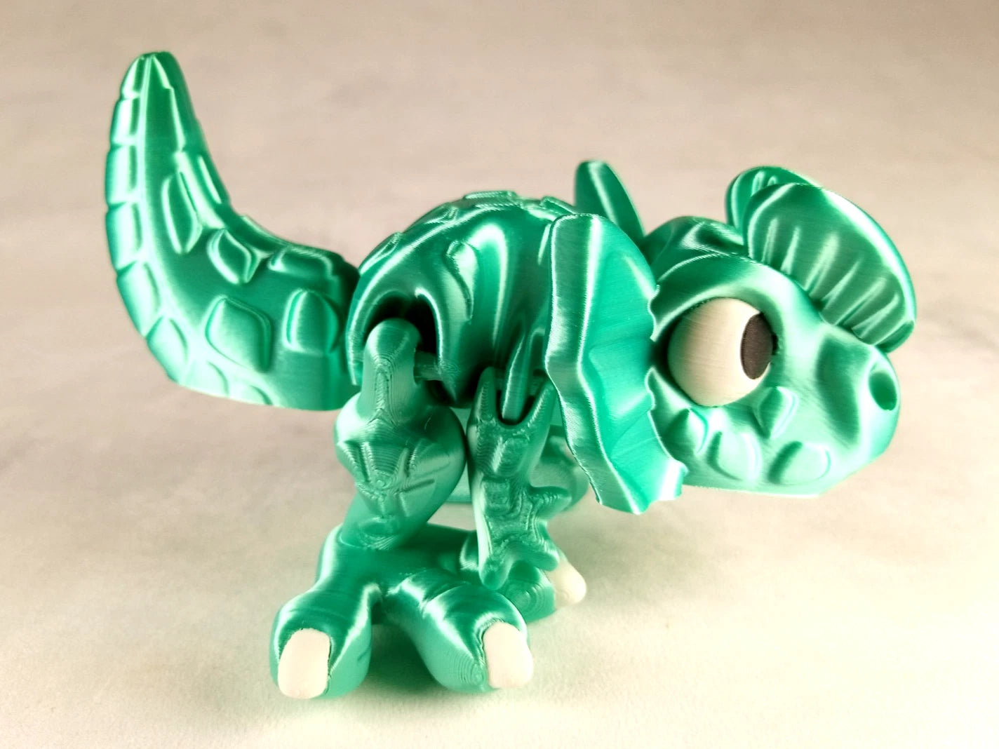 Dilophosaurus Flexi Dinosaur, Dinosauro articolato verde menta seta stampa 3D a colori PLA lunghezza 14 cm.