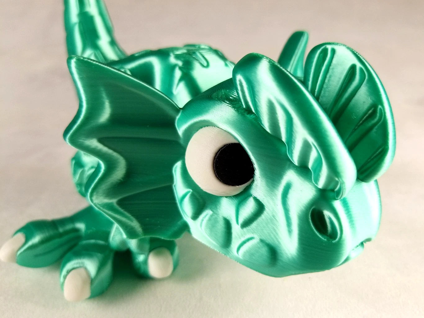 Dilophosaurus Flexi Dinosaur, Dinosauro articolato verde menta seta stampa 3D a colori PLA lunghezza 14 cm.