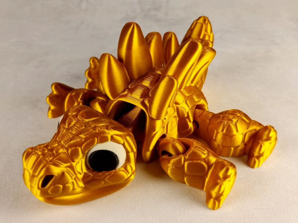 Stegosaurus Flexi Dinosaur, Dinosauro articolato Oro seta stampa 3D a colori PLA lunghezza 16 cm.