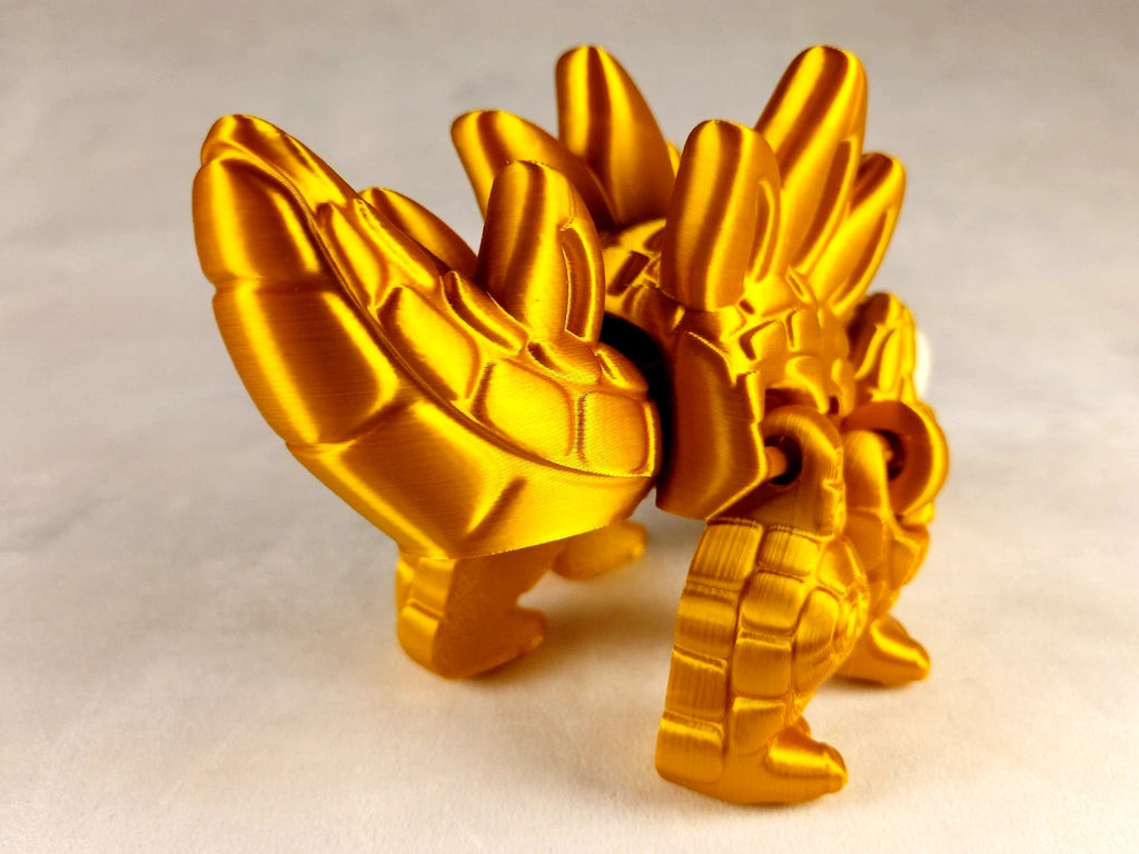 Stegosaurus Flexi Dinosaur, Dinosauro articolato Oro seta stampa 3D a colori PLA lunghezza 16 cm.