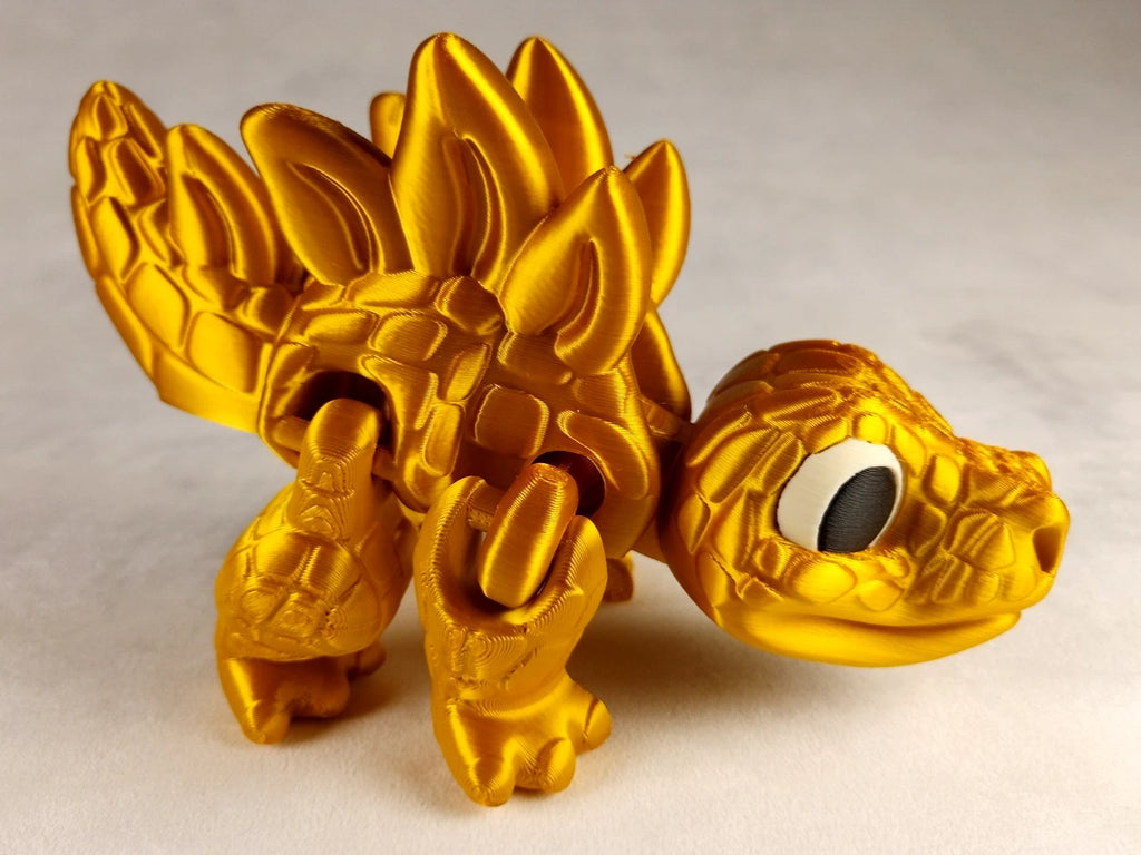 Stegosaurus Flexi Dinosaur, Dinosauro articolato Oro seta stampa 3D a colori PLA lunghezza 16 cm.