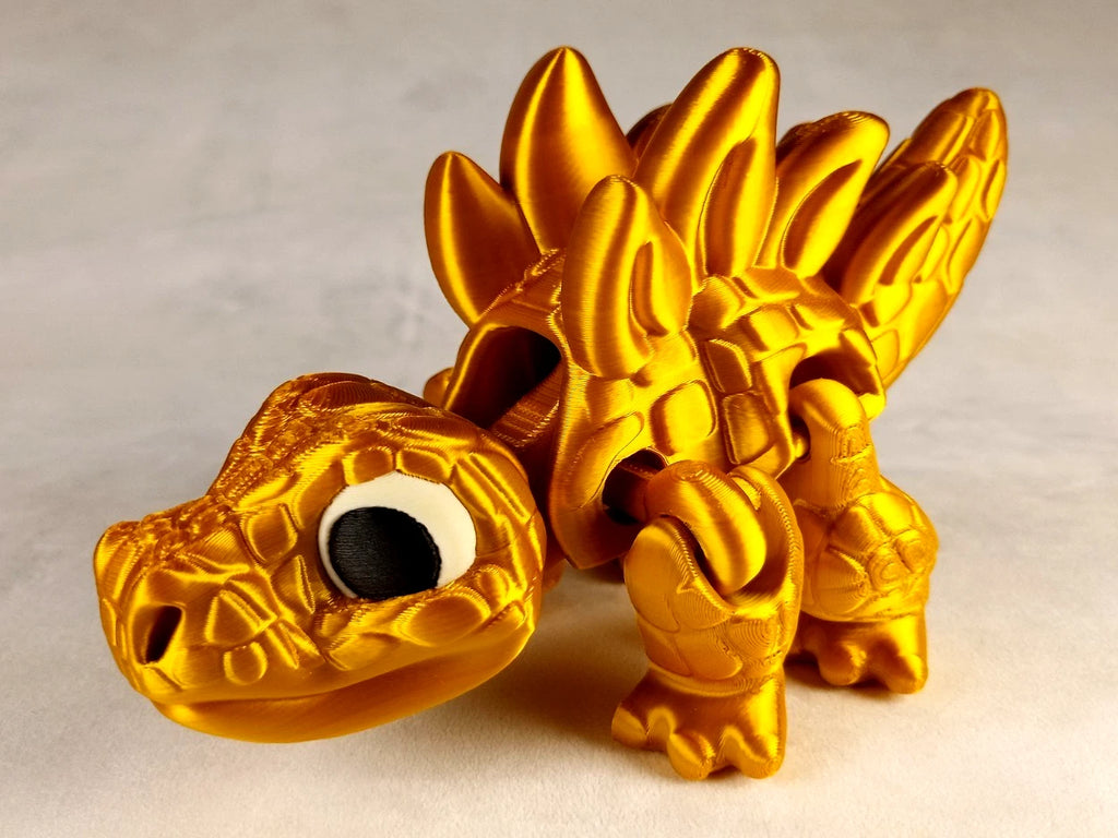 Stegosaurus Flexi Dinosaur, Dinosauro articolato Oro seta stampa 3D a colori PLA lunghezza 16 cm.