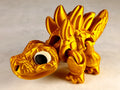 Stegosaurus Flexi Dinosaur, Dinosauro articolato Oro seta stampa 3D a colori PLA lunghezza 16 cm.
